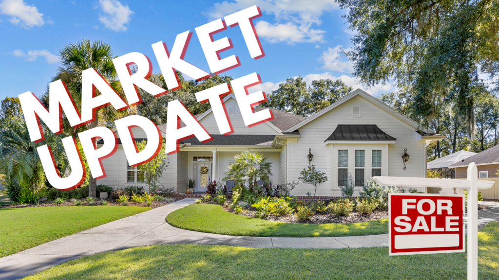 A well-maintained single-family home in Gainesville with lush landscaping, surrounded by palm trees and a clear blue sky, featuring a "FOR SALE" sign and overlaid with bold "MARKET UPDATE" text.